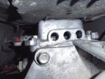 24 Mazda transmission shift rail openings after plugs removed.jpg