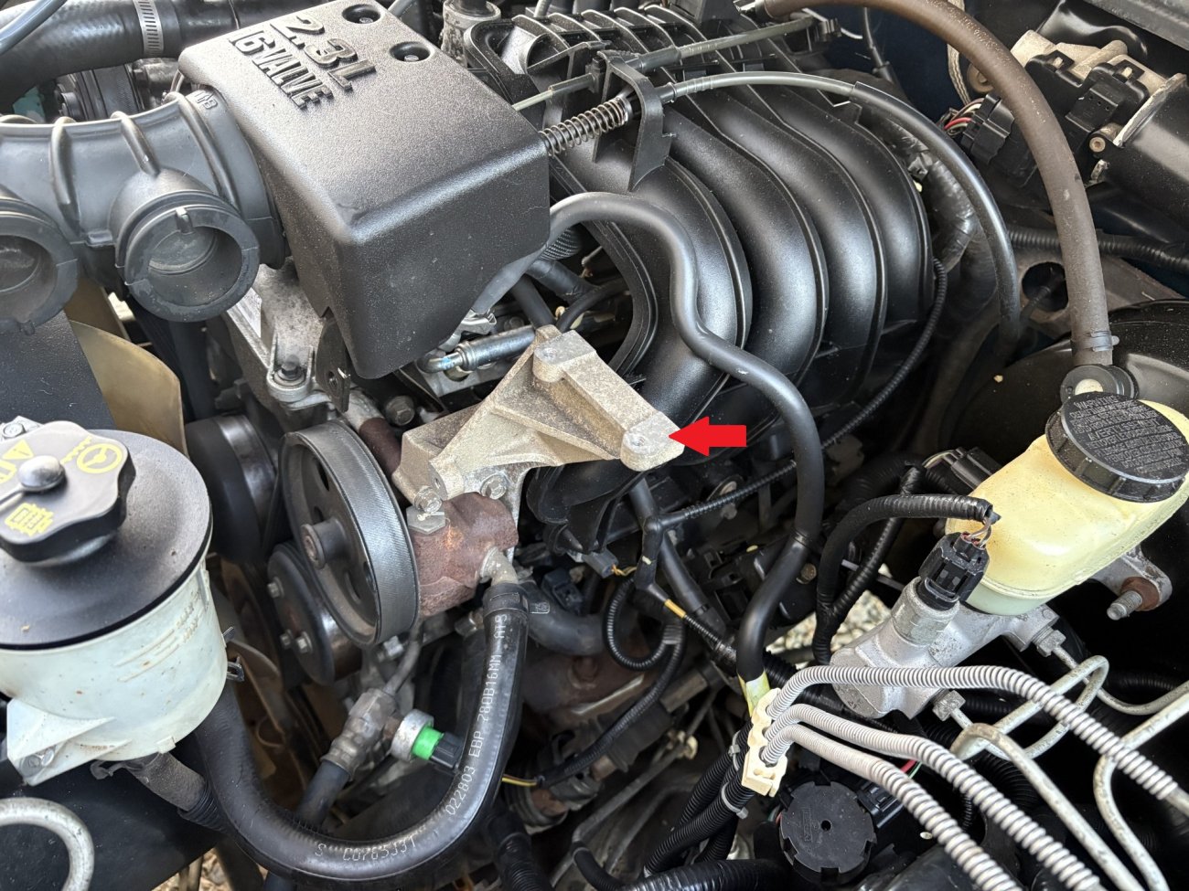 bracket under Hood at engine.jpg