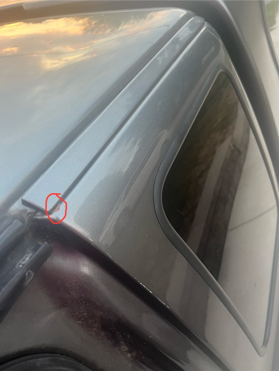 Rust under trim above rear “seat” windows