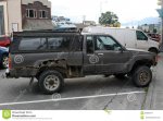 rusted-badly-car-city-street-still-driving-parked-62083474.jpg