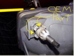 Original factor OEM headlight with notches to allow adjusting of headlight beam.jpg