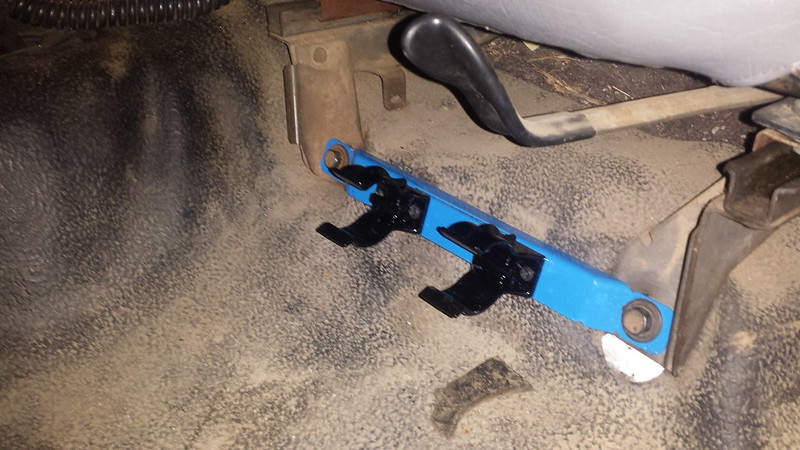 Flashlight mounted to seat mountng bolts.