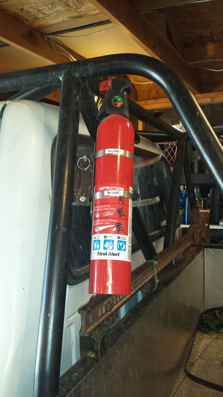 Flashlight mounted to seat mountng bolts.