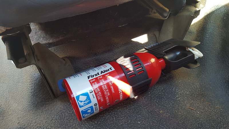 Flashlight mounted to seat mountng bolts.