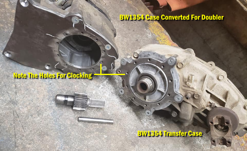 BW1354 transfer case shell that has been built into a doubler with a clocking ring that bolts to the main transfer case.