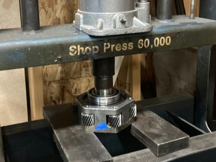 pressing the shaft out of the bearing