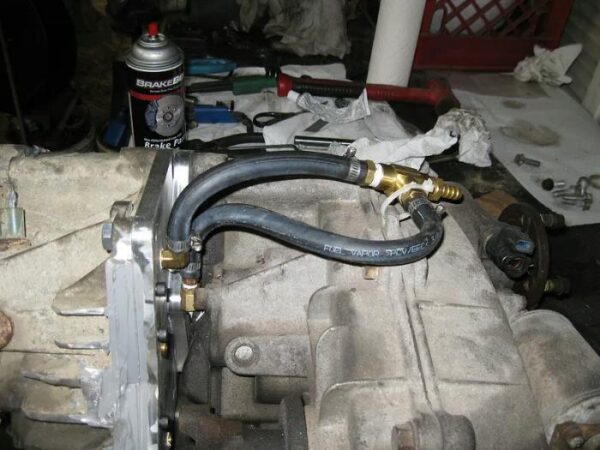 Transfer case and doubler case breathers joined by a t-fitting