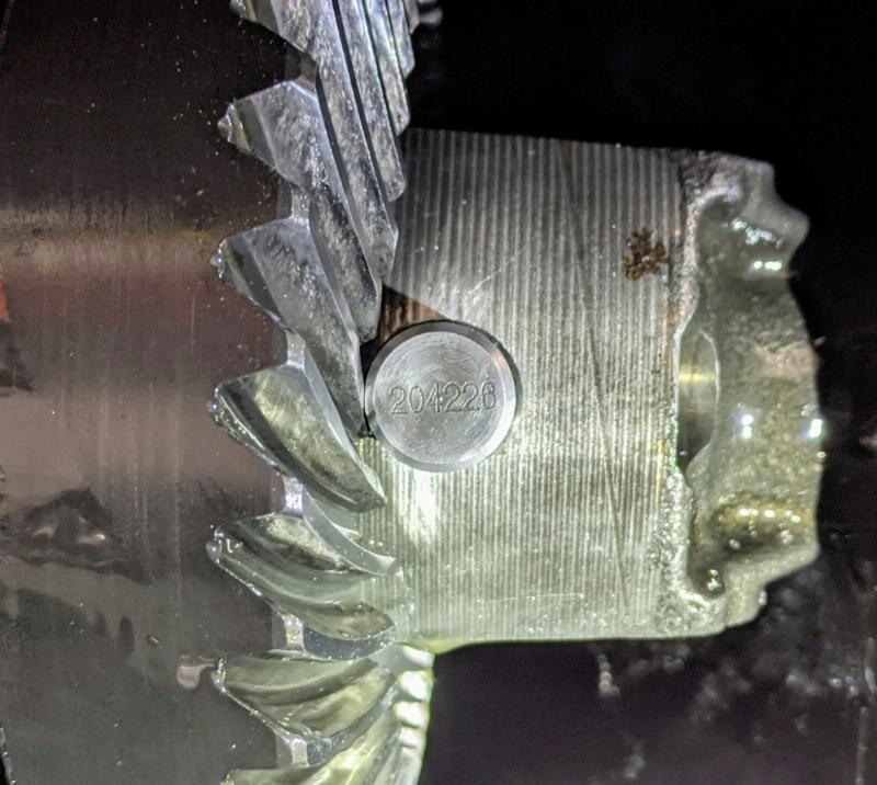 Gear tooth on 4.56 gears in a Ford 7.5-Inch axle ground for cross pin clearance