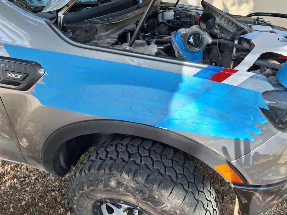 Cover the fender with masking tape