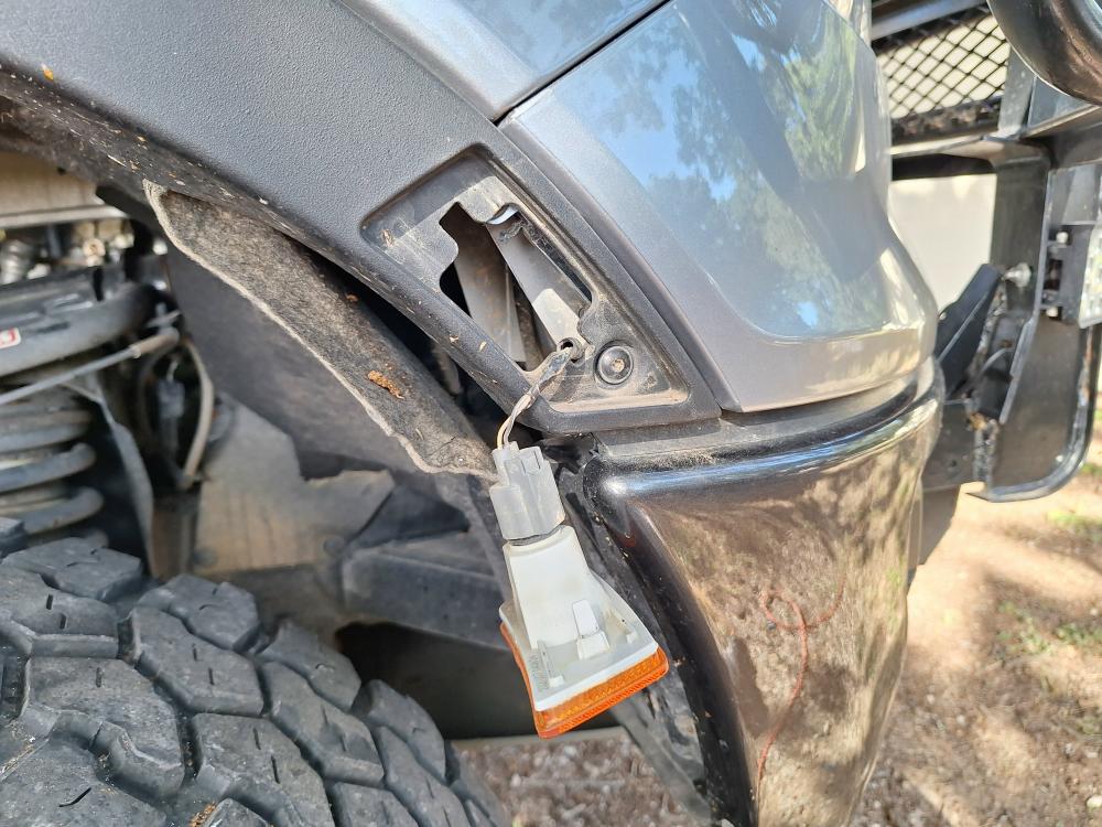 remove the marker light in the fender flare