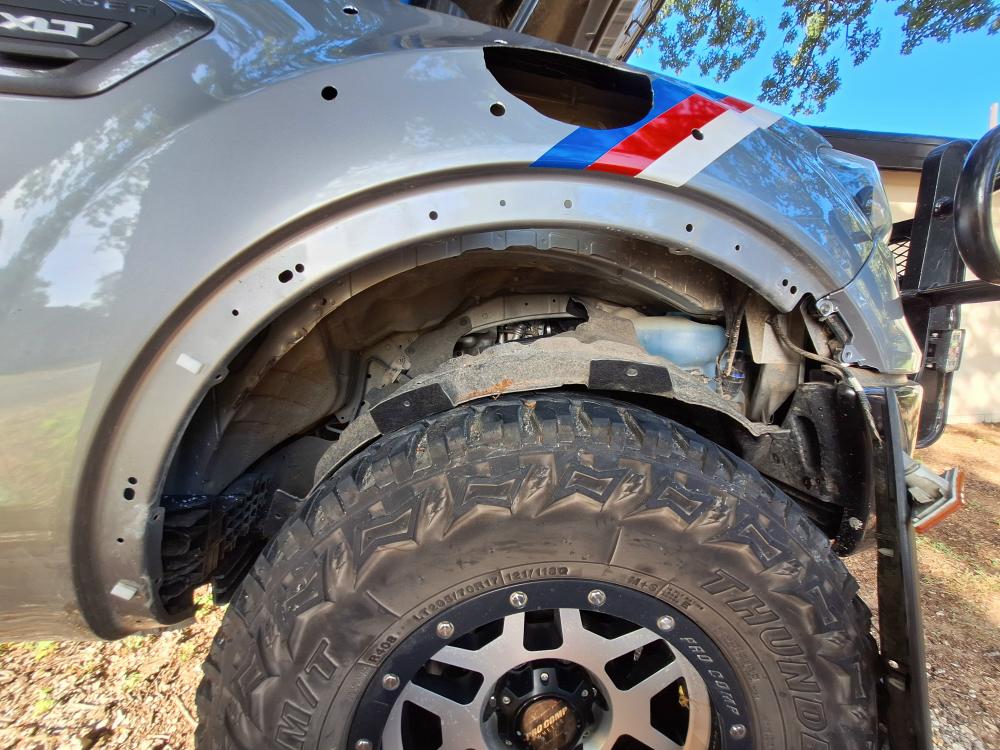 Once all of the clips are out you can drop the fender liner down