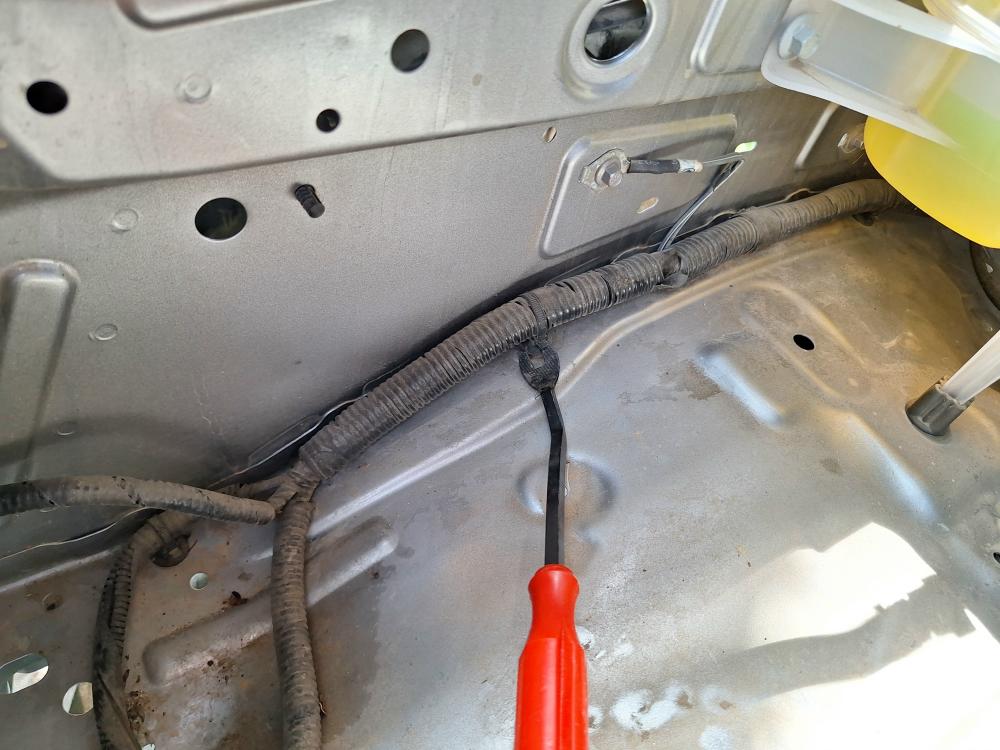 In the inside of the engine bay, you need to unclip this wire loom