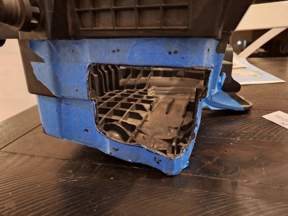 I positioned the snorkel hose to it and found that the holes weren't going to line up with the holes in the snorkel. So, I used the snorkel for my template for the mounting holes