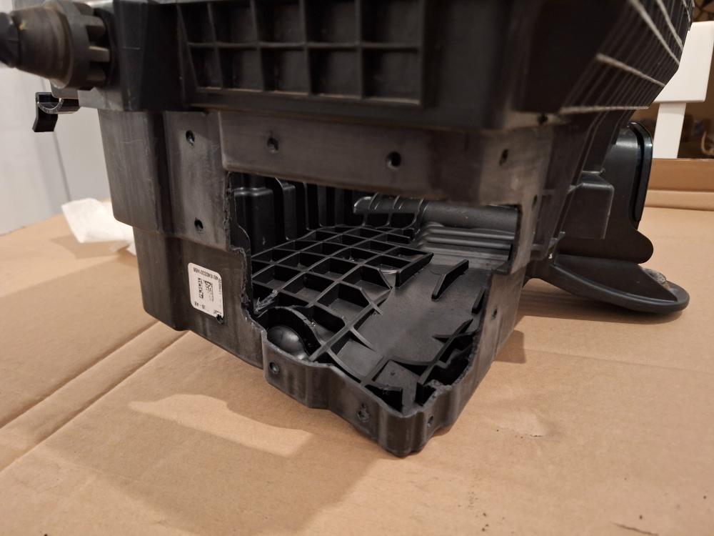 mounting holes drilled into the air box