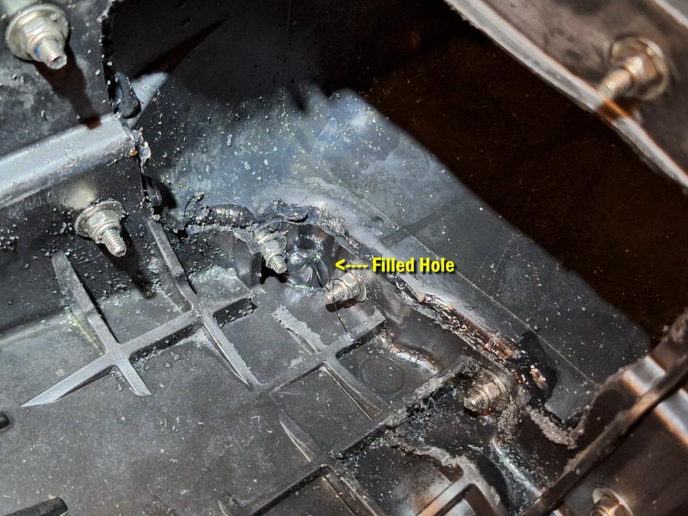 On the inside I filled the hole with Sikaflex 227 to help seal it up