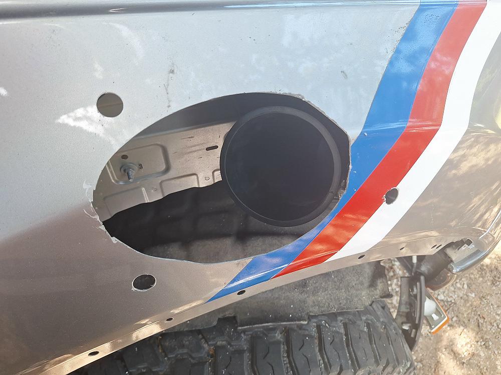 With the airbox back in place, the rubber intake will be aligned with the hole you cut in the fender