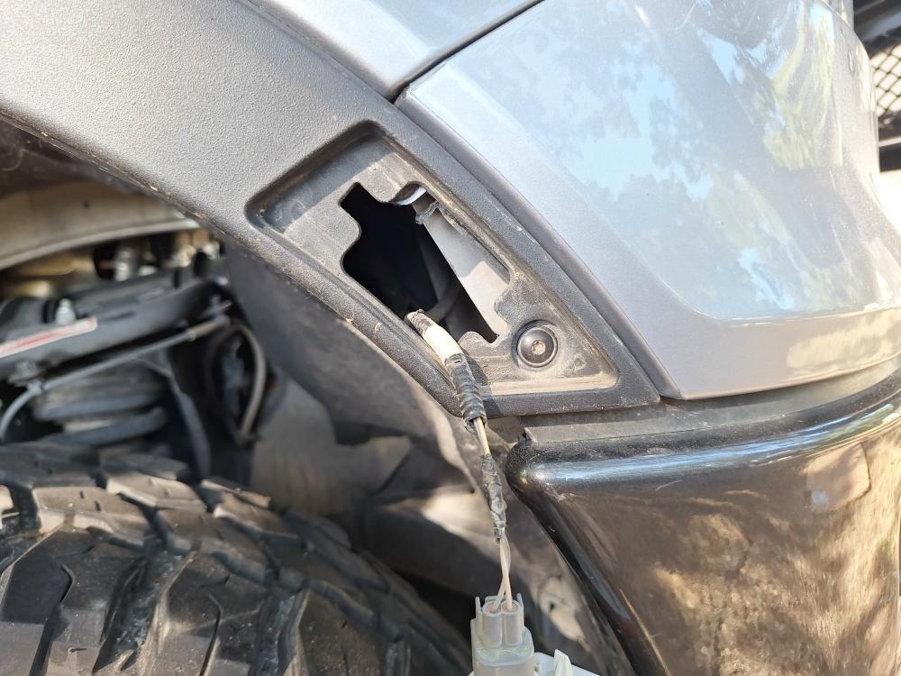 reinstall the light in the fender flare