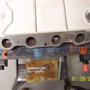 Bottom view of pilot holes. I'm not sure if it takes guts or stupidity to take a drill to a perfectly good manifold.