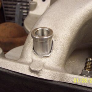 Once the holes have been drilled all the way out to 7/8", the jig is bolted back on and the bungs are test fitted.  The bungs actually sit on the top of the drill tubes to locate them vertically in the runners.  I plan on smoothing off the rough remnants of the old bosses seen in these pics.
