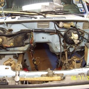 Neatened up the engine's wiring harness and removed inner plastic fenders so I can see stuff easier. Wiring used to drape over the front of the engine, which I did not like at all.
