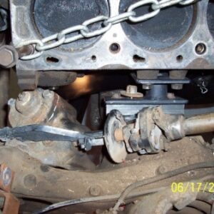 After a week of looking, thinking and adjusting...*ta-da*..the final engine mount. Driver's side, FRPP 460-to-Fox body pedestal sitting on 1" thick square tube. Note filter pad to steering box clearance. I'll get to that later. A slimmer Aerostar steering shaft will also replace the stock one.