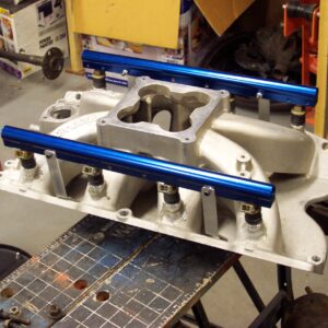 As mounted on the intake.  I made some aluminum straps that retain the rails and bolt on through the intake manifold bolts.