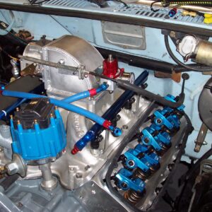 It became very clear that the reg location and fuel line routing I had planned was not going to work well.  I relocated the reg to the intake elbow and redid the fuel lines to feed from the front.