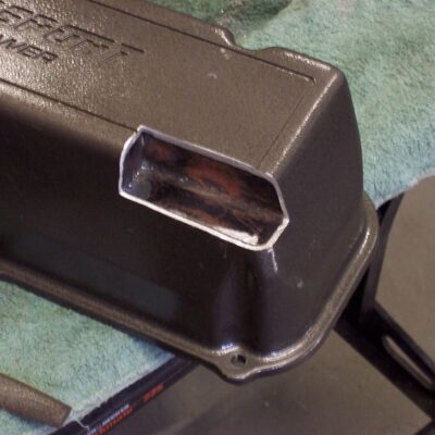 Another thing that became clear was the fact that the back corner of the valve cover and the brake power booster were trying to occupy the same place in the engine bay. After weighing my options, I decided that notching the valve cover was the best choice.