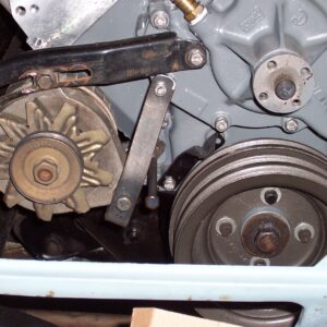 Next, I fabbed up a low alternator mount that would work with my oddball pulley setup.  It tucks the alternator down and back pretty tight to the block.