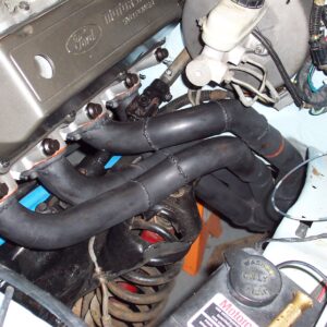 The driver's side header finally installed....along with a lot of my knuckle-meat