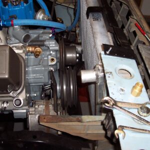 Installed the radiator and checked for electric fan clearance. It's a good thing I used the short water pump. It's tight up there!