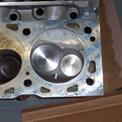 You can see nicks in the head and a dark band where the piston hit the head.  This was caused by what I found in the next pic...