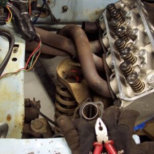 Header mods have begun.  This is a set of Hooker fenderwell headers for a big block Chevy in a Chevy II. While the *look* like the fit pretty well, they definitely needed modification to fit a Ranger.