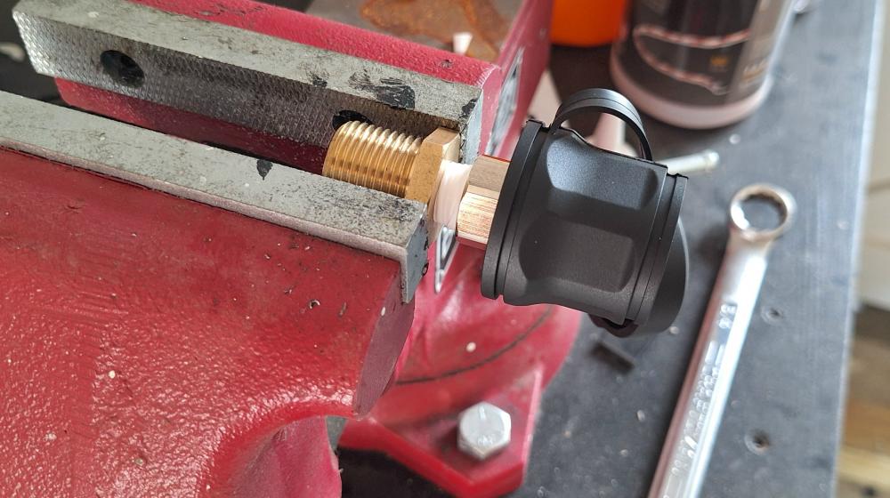 Using a vice to hold the bulkhead connector