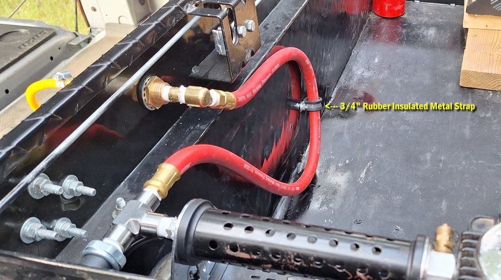 Securing the leader hose with a 3/4-inch rubber insulated metal strap