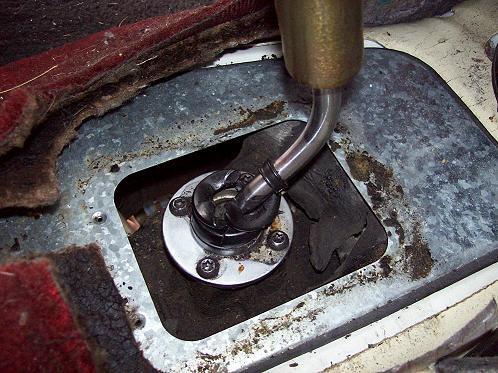 Remove the floor plate using a 8mm socket.