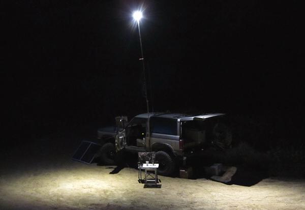 Ford Bronco II camping at night