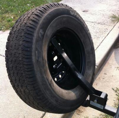Folding tire carrier with tire mounted - 2
