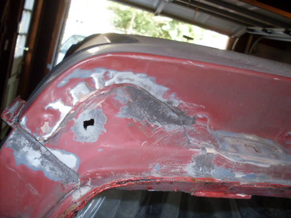 Rust hole in rear hatch area