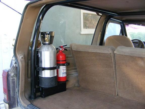 Ford Bronco II rear cargo are with on-board compressed air tank and fire extinguisher