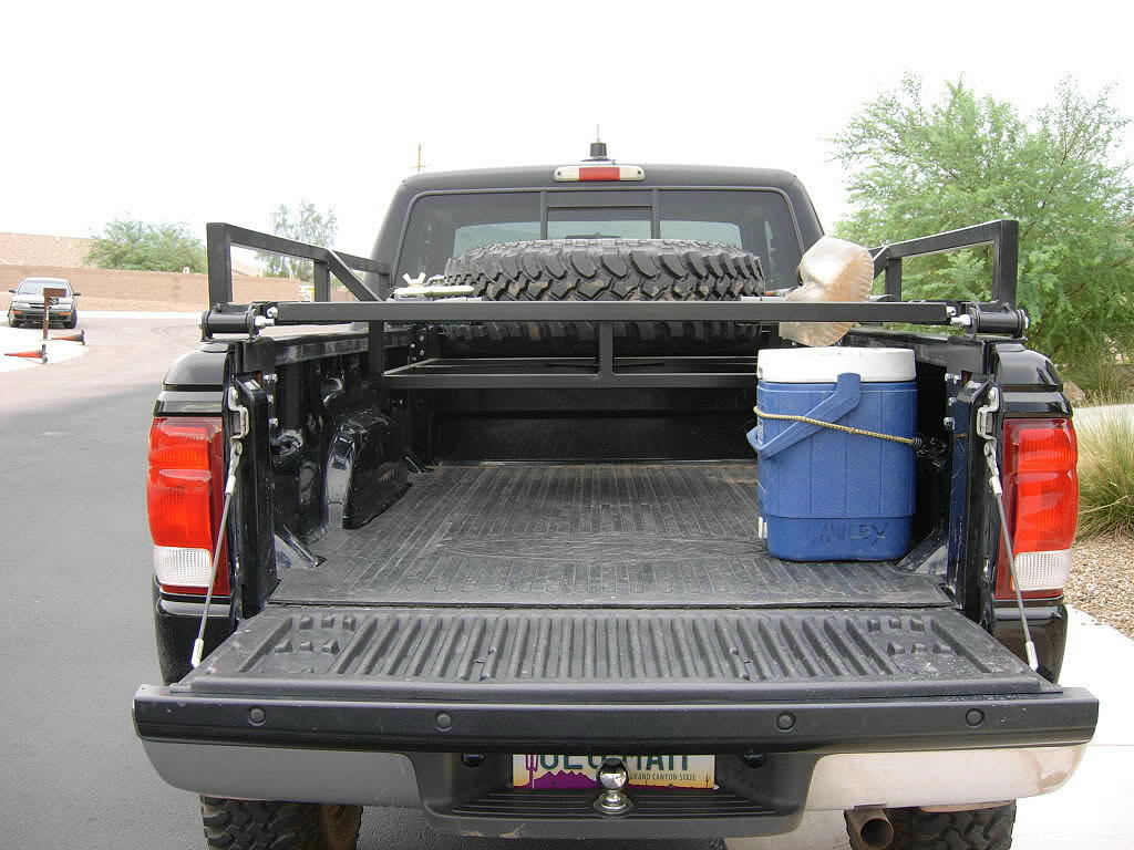 Space for camping gear under the bed rack