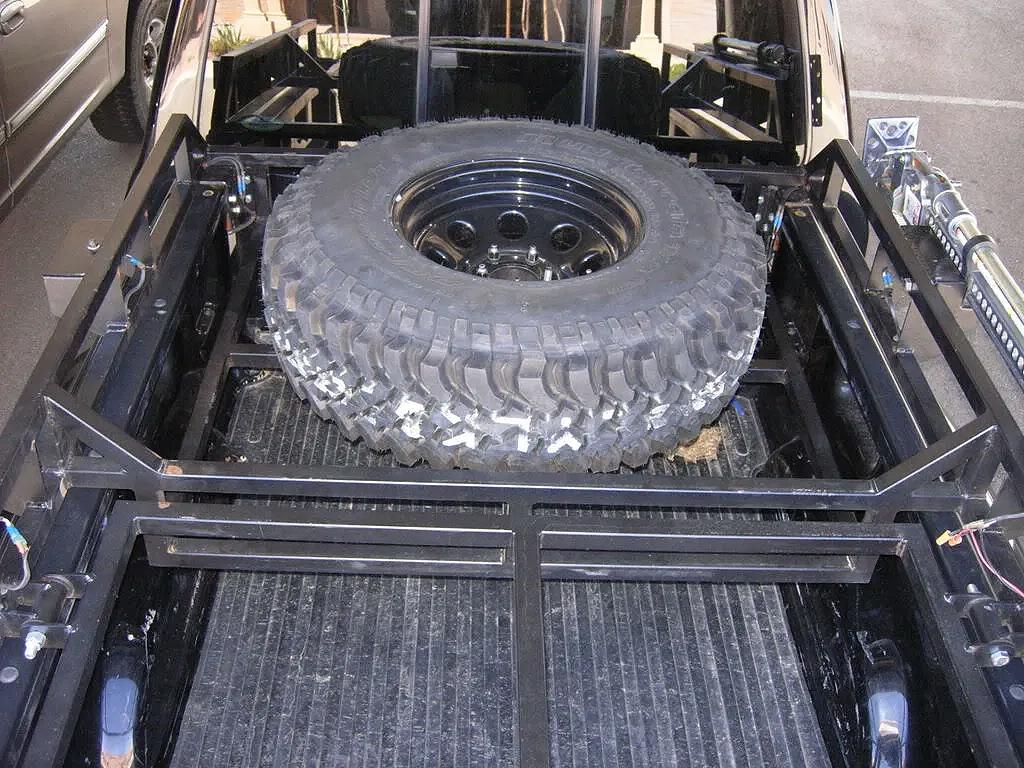 Bed rack tire carrier