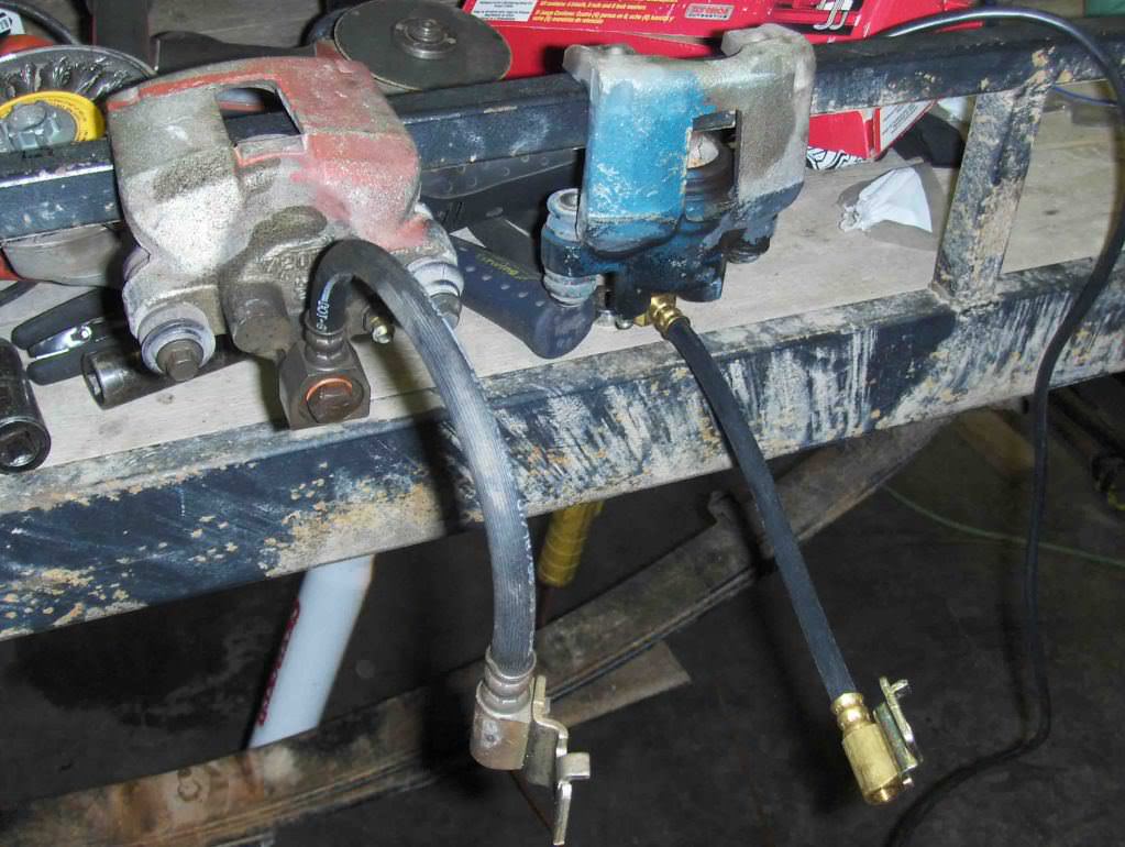 Rear brake calipers and brake lines