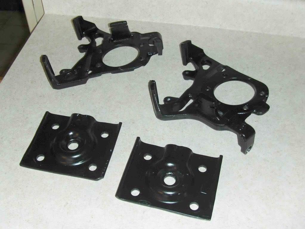 Spring retainer plates and caliper brackets